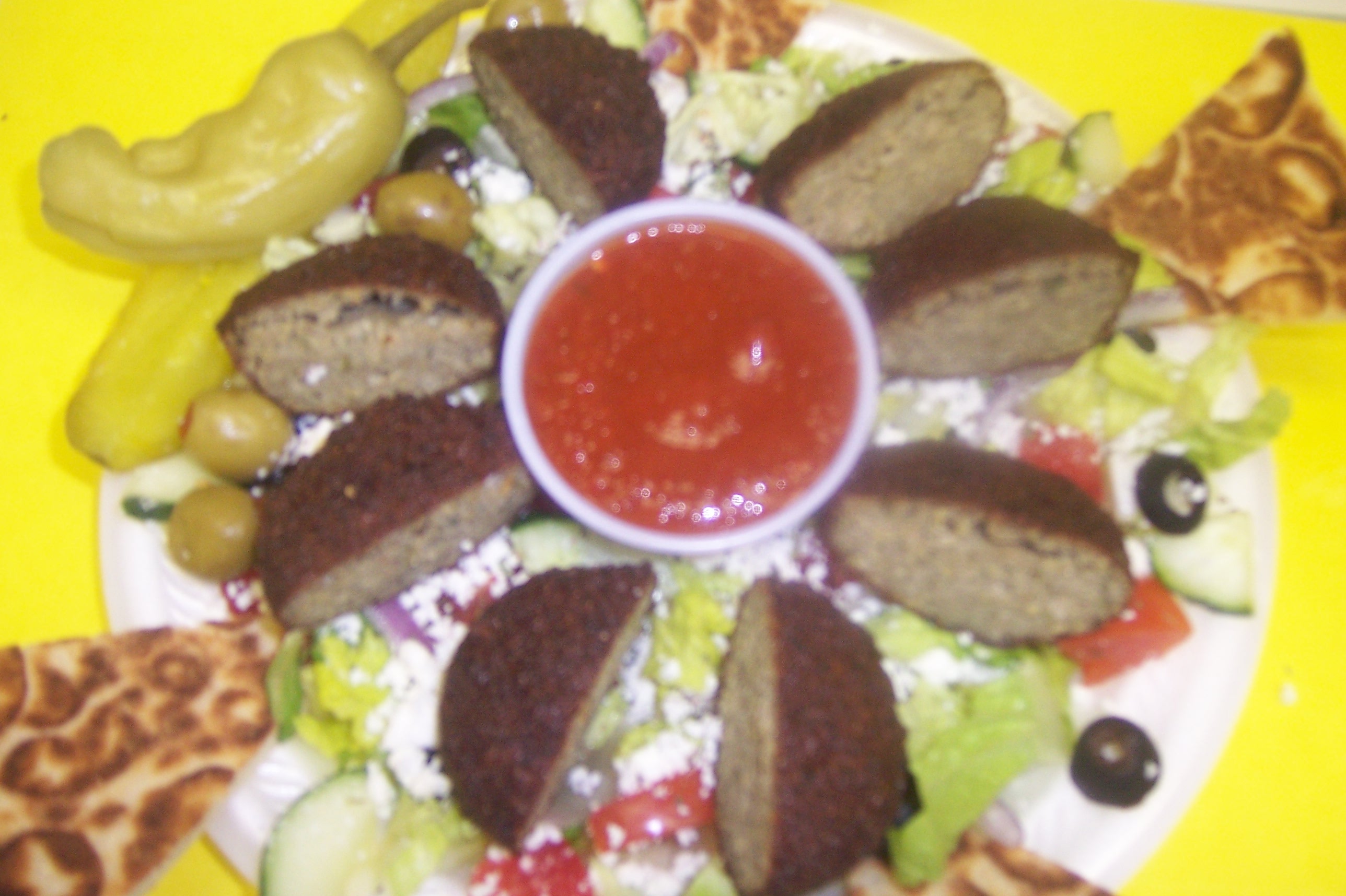 Close-up of a falafel salad with tahini dressing